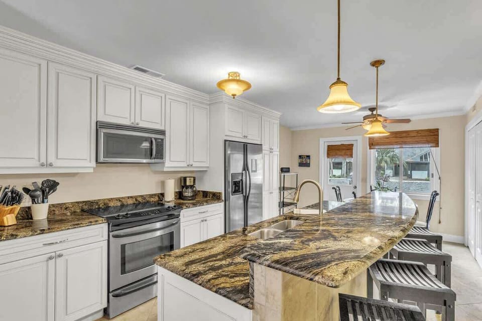 Modern kitchen with granite countertops and stainless steel appliances