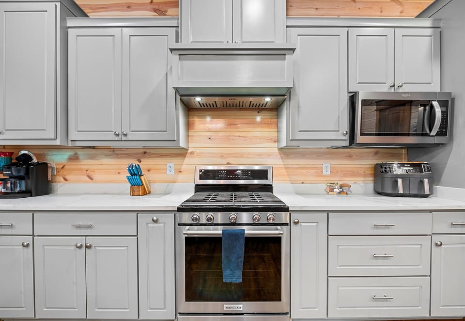 A closer look at the kitchen shows off the beautiful cabinetry, modern finishes, and everything you need to feel right at home.