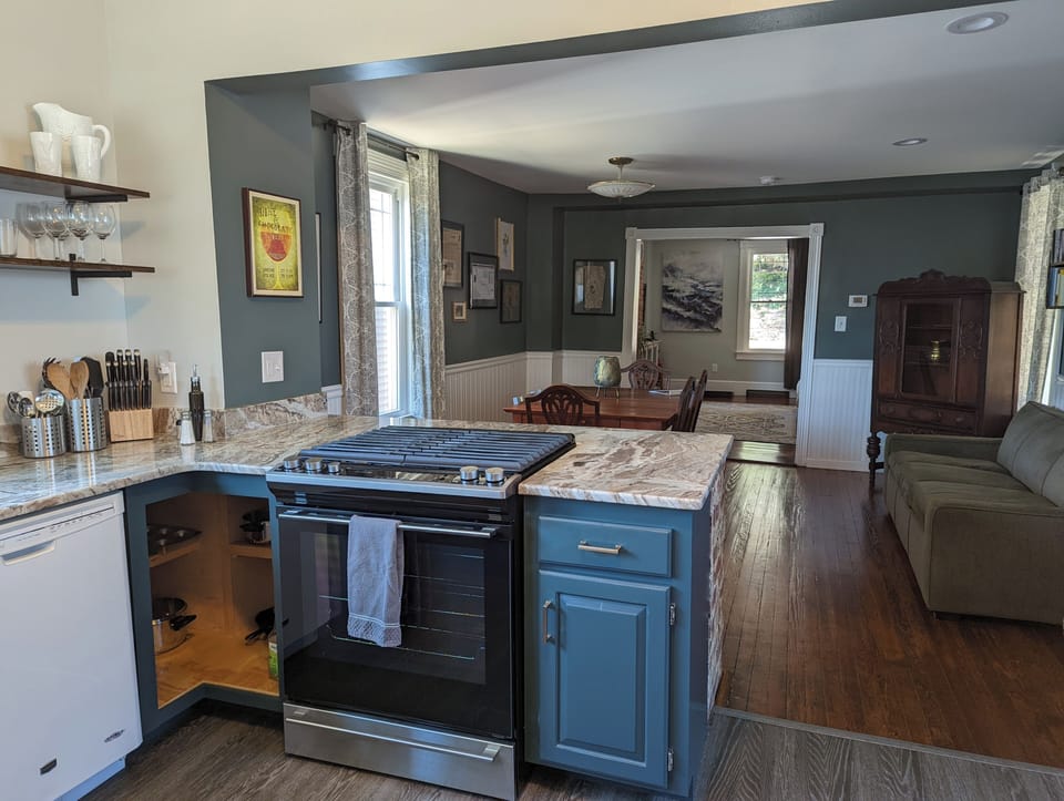 Kitchen looking into dining room, with living room beyond that