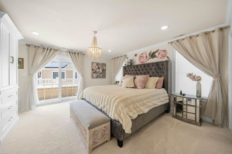 Master bedroom with ensuite bathroom and private balcony