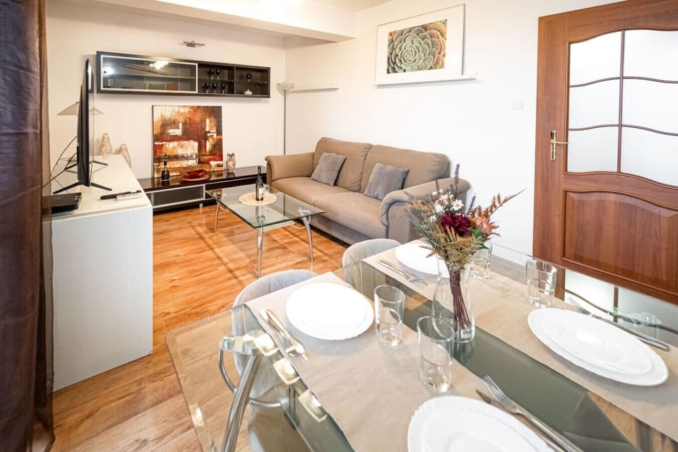 Living Room with Smart TV and Dining Table | Book Now with RENTUJEMY.COM