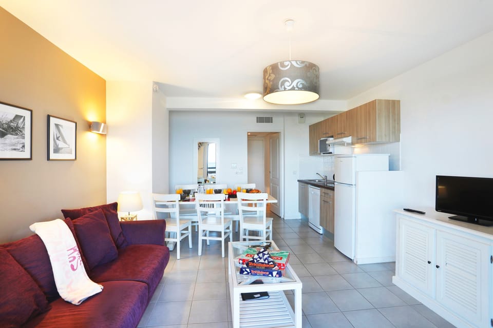 Prepare meals in the kitchenette and enjoy them at the dining table.