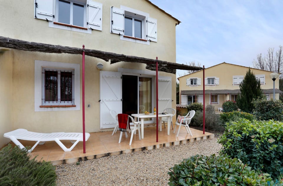 Enjoy a cozy meal outdoors, surrounded by the charm of village architecture.