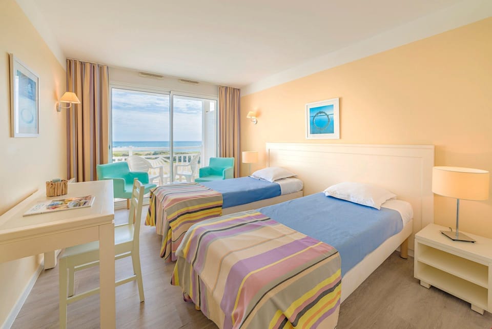 The master bedroom features two comfy single beds.