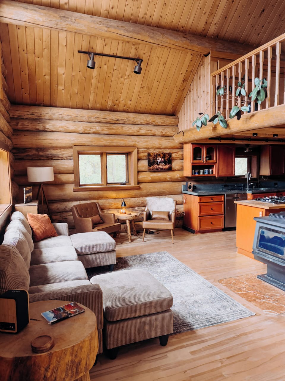 A cozy living room with beautiful vaulted ceilings.