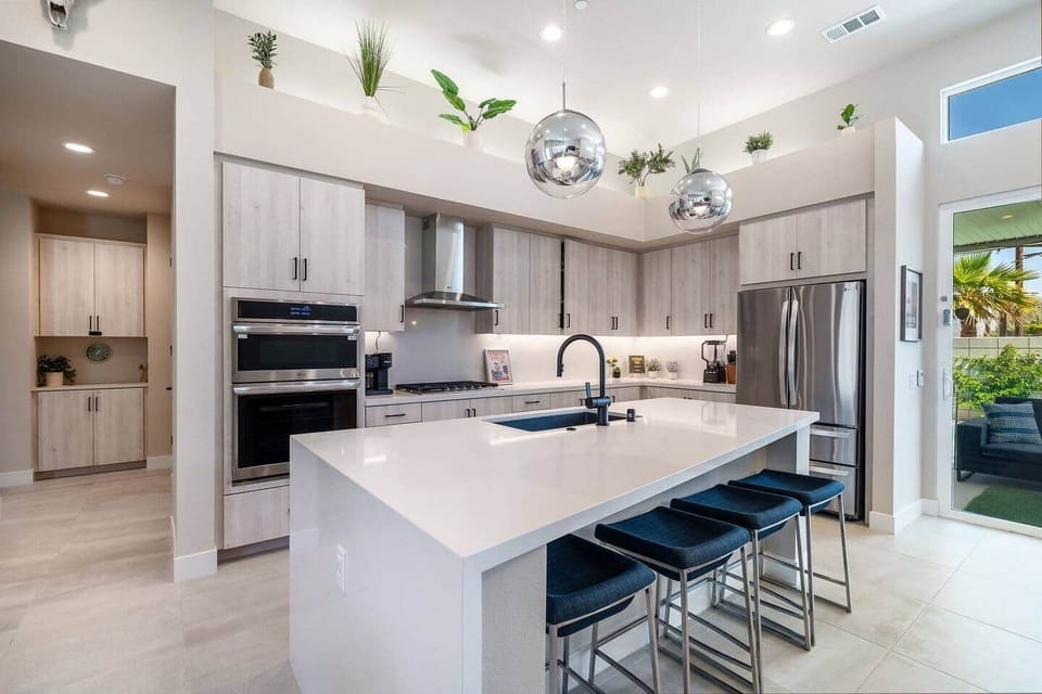 Open-concept kitchen with island dining for 10.