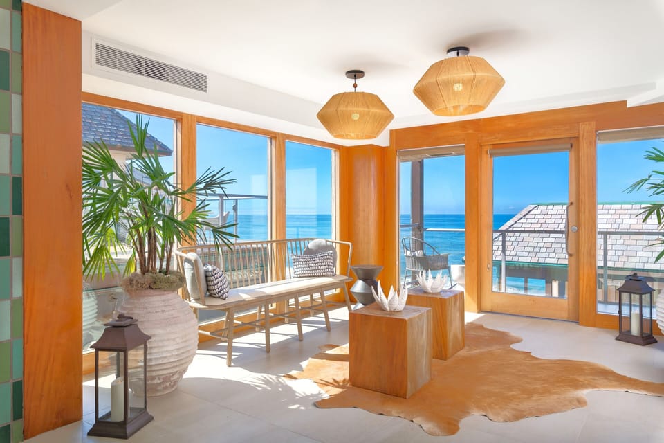 Sip morning coffee in sun-drenched seating with endless ocean views