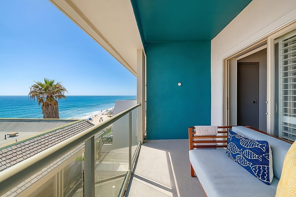 Breathe in salty air with sweeping beach-and-palm views.
