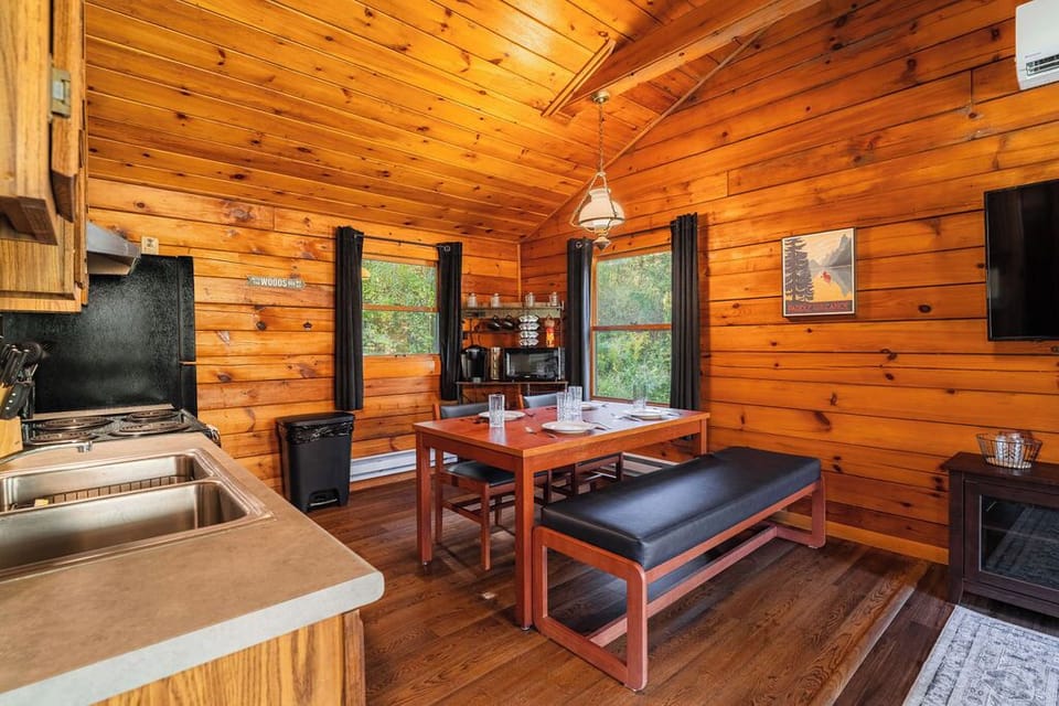 Open-concept kitchen and dining area with full appliances and seating for up to six—perfect for meals or game night.