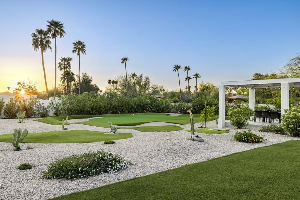 Private backyard with nine tee boxes and huge putting green