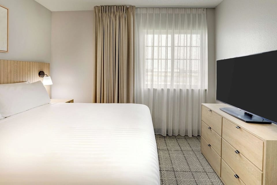 Wake to soft daylight and enjoy a movie from bed.
