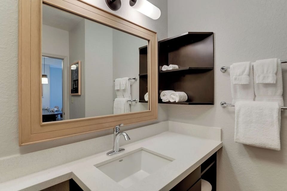 Refresh easily with bright vanity lighting and plush towels.