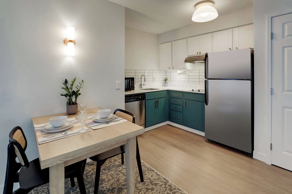 Cook easy meals in the bright kitchen with full-size fridge.