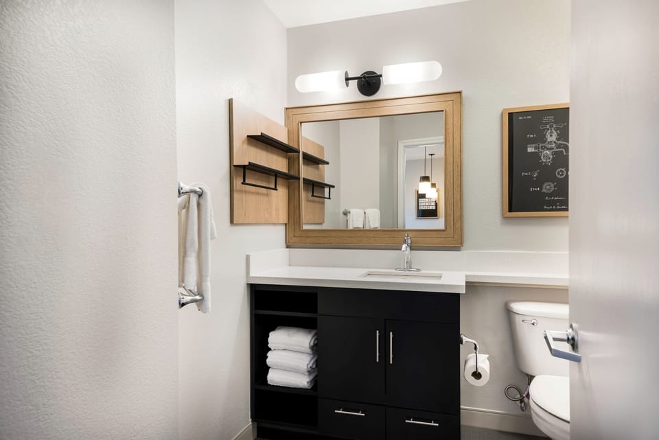 Refresh easily with a bright vanity and fresh towels ready.