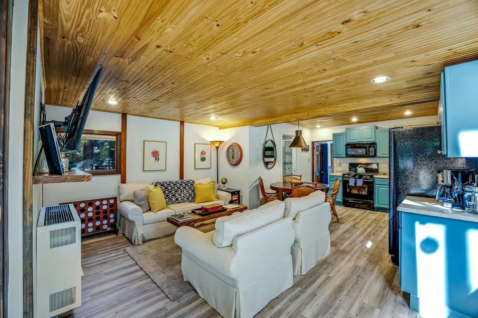 Unwind in the living room with a smart TV, perfect for movie nights.