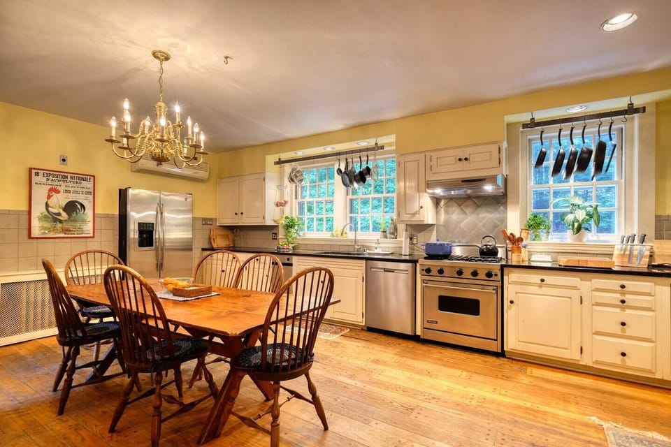 The kitchen is fully equipped with high-quality cookware, utensils, and all the essentials for preparing meals with ease — highlighted by a professional-grade Viking stove for the culinary enthusiast.