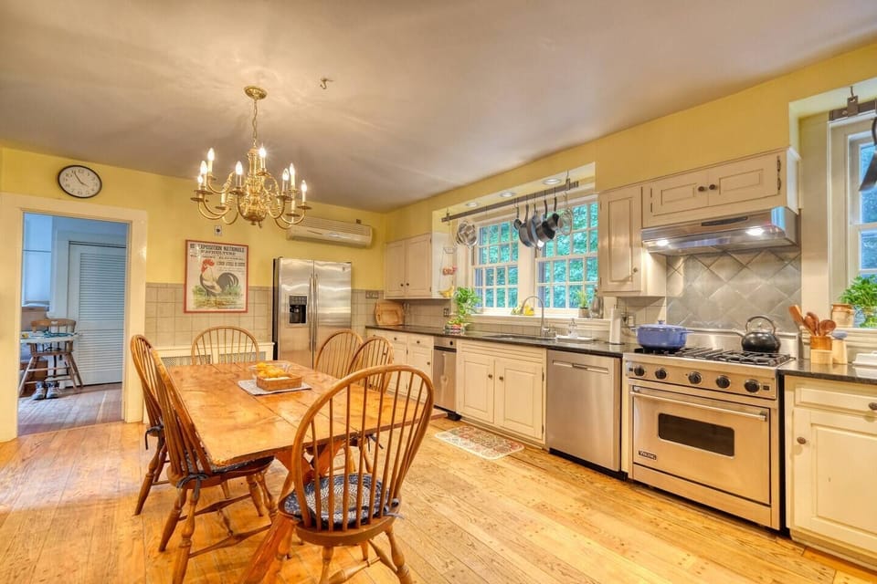 The kitchen is fully equipped with high-quality cookware, utensils, and all the essentials for preparing meals with ease — highlighted by a professional-grade Viking stove for the culinary enthusiast.