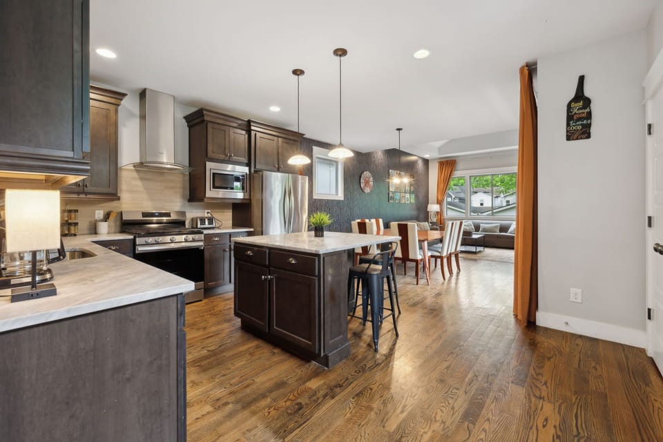 Kitchen: Your gourmet getaway awaits! Enjoy cooking with top-tier stainless steel appliances and ample counter space on beautiful white marble.