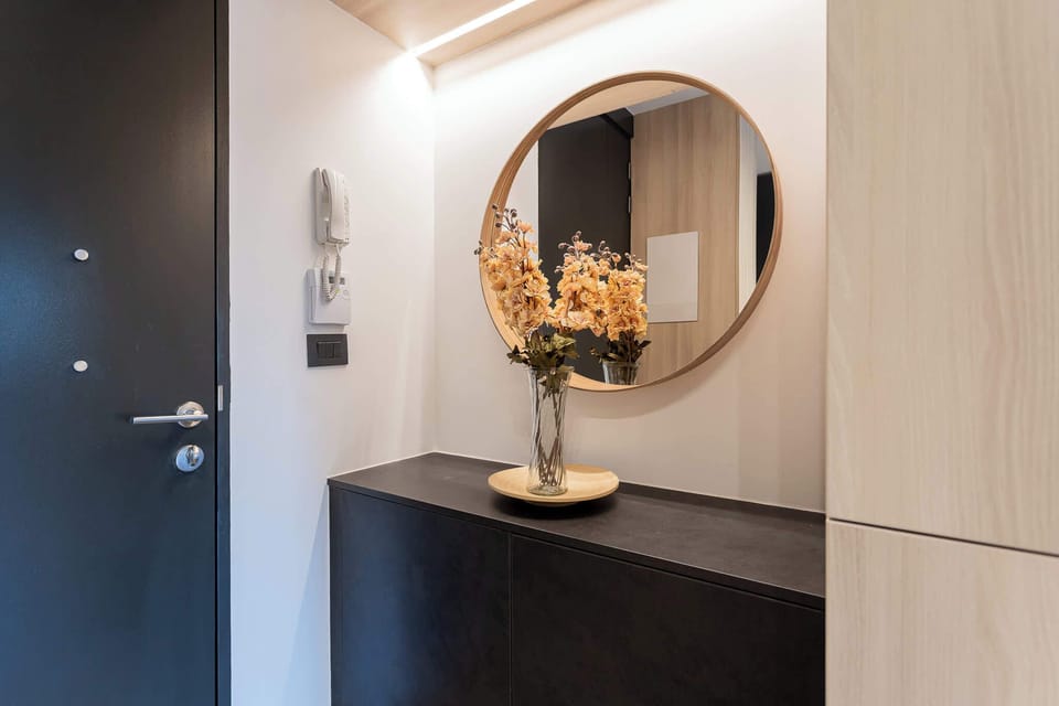 Step into a stylish entryway featuring a modern design, elegant decor, and a welcoming atmosphere that sets the tone for your stay.