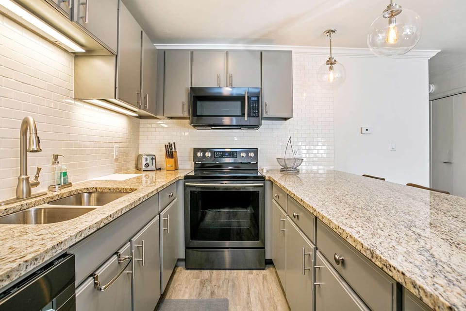 Fully Equipped Kitchen and Bar Seating