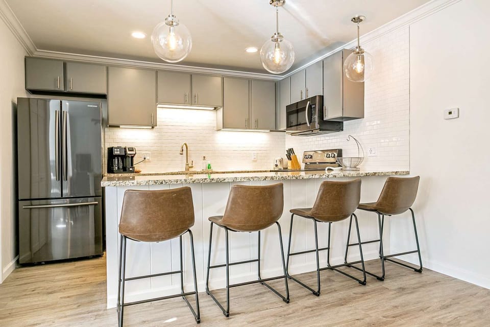 Fully Equipped Kitchen and Bar Seating
