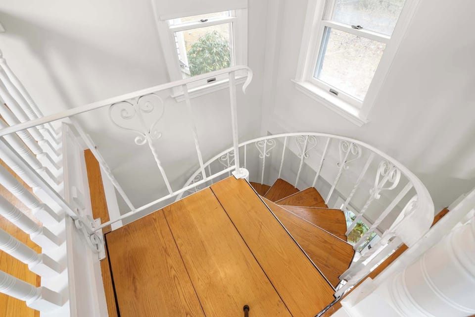 Spiral staircase to second floor lofted bedroom