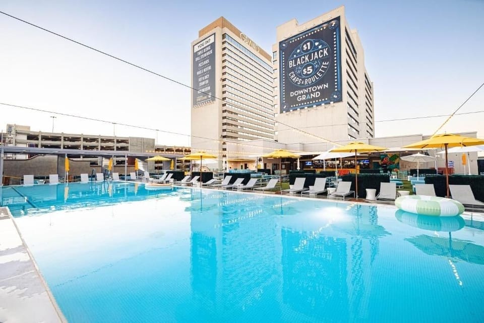 Dive into sparkling rooftop pool days with loungers and sunshine.