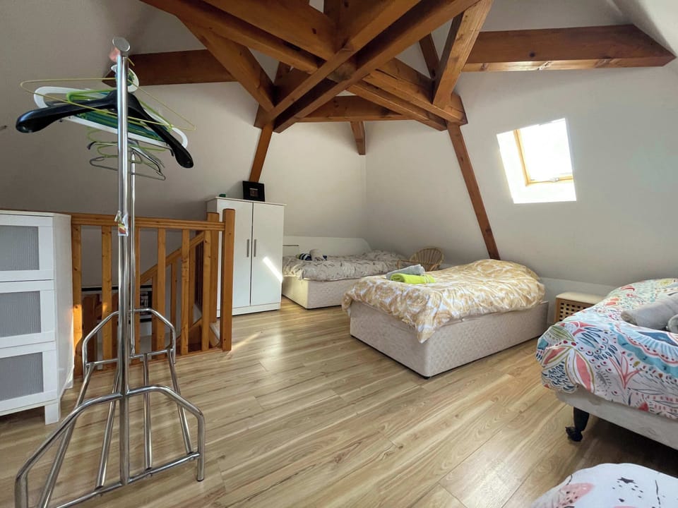 Second floor bedroom with 4 single beds