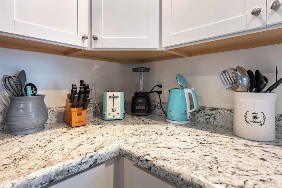 A spacious kitchen counter with all the essentials you’ll need for cooking during your stay.