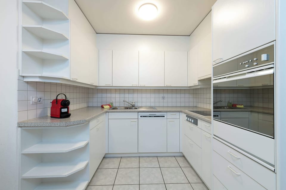 Lively kitchen that's stocked up with the all the requirements suitable for a master chef