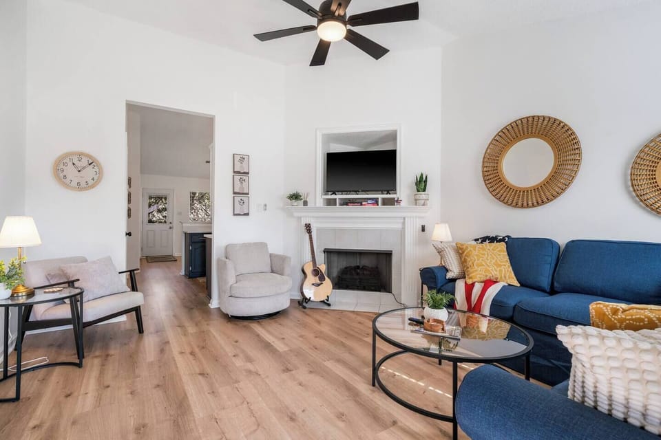 Kick back in our spacious, airy living room—perfect for games, strumming the guitar by the cozy fireplace, or binge-watching your favorite shows on Roku!