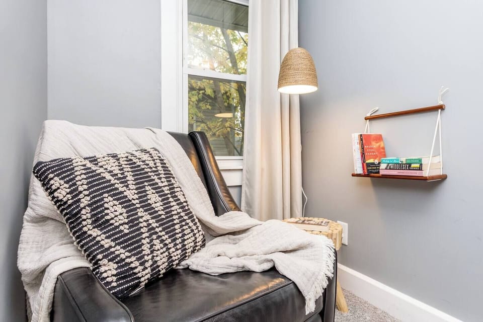 Primary bedroom offers a cozy nook to relax.