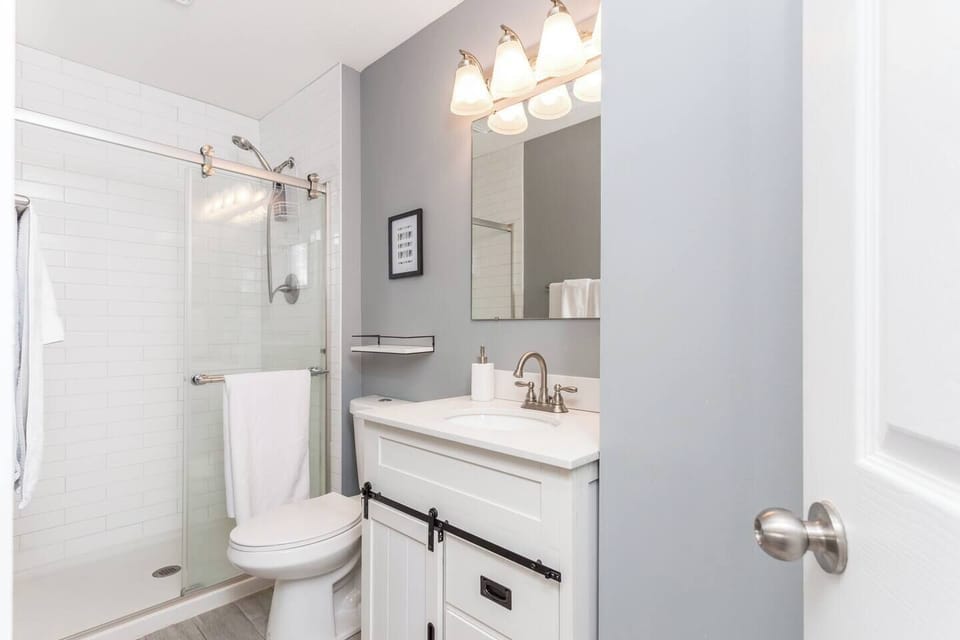 Primary bedroom ensuite bath features a tiled walk in shower.