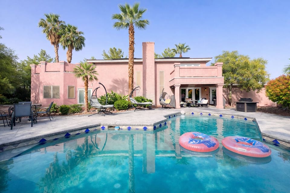 House #1 backyard with pool, spa, outdoor lounge, dining, and BBQ