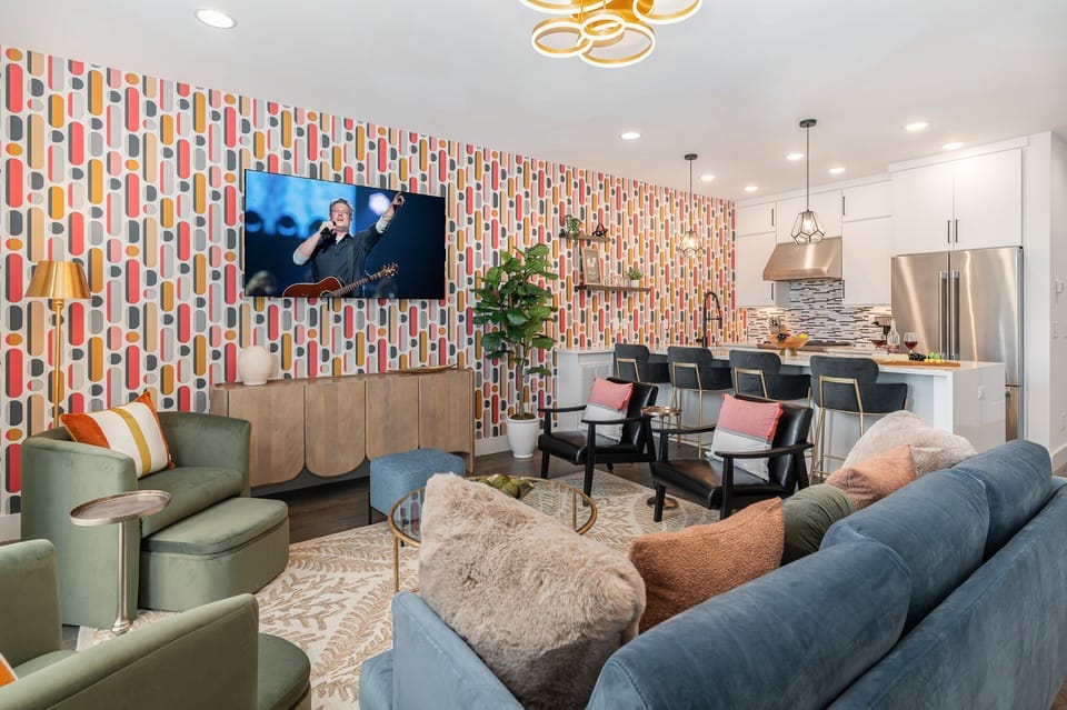 2nd Floor: Bright and colorful open-concept living area featuring a Smart TV and stylish furnishings.