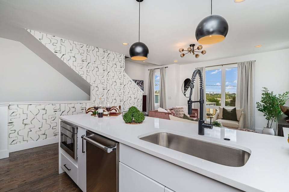 Fully equipped kitchen with stainless steel appliances and a kitchen island with seating for 4 guests. (2nd Floor)