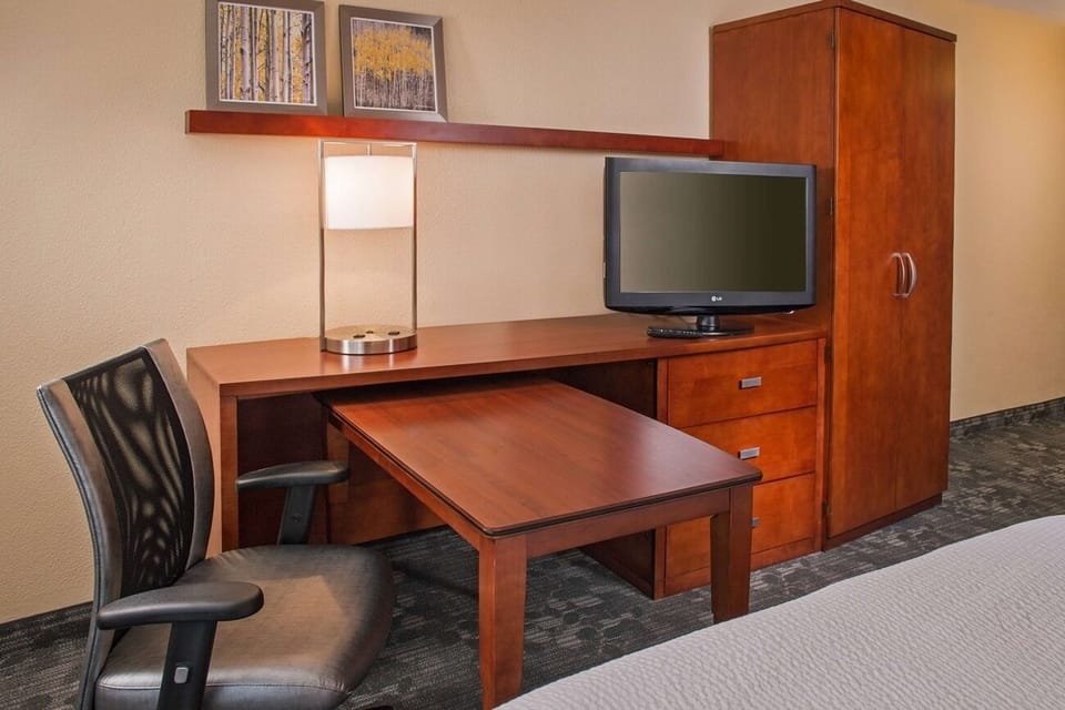 Get focused at the in-room desk with convenient TV setup.