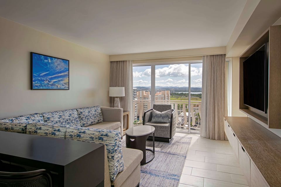 Kick back in the bright lounge with balcony breezes.