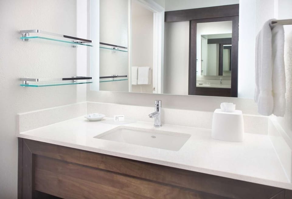 Refresh at the bright vanity with spa-clean countertops.