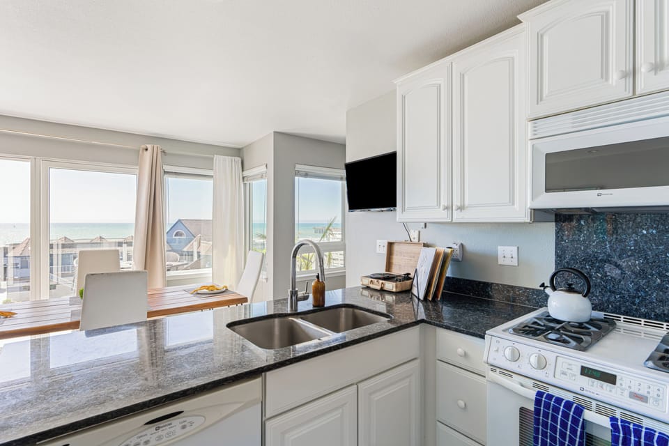 Sleek modern kitchen with ample counter space and appliances.