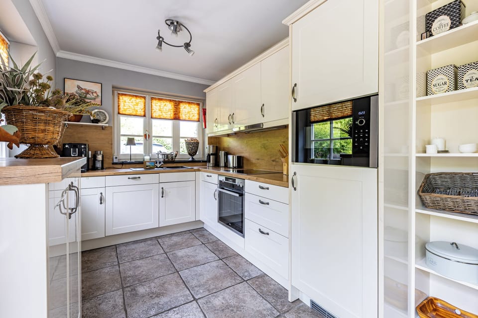 Modern Kitchen with White Cabinets and Appliances