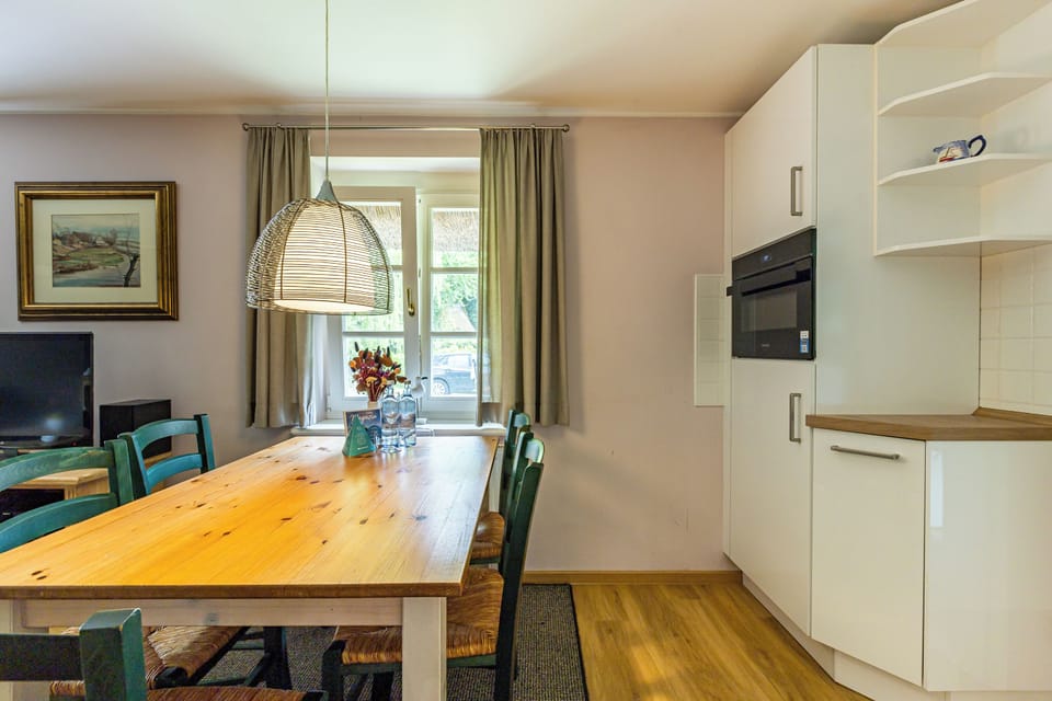 Modern Kitchen with Dining Table and Windows
