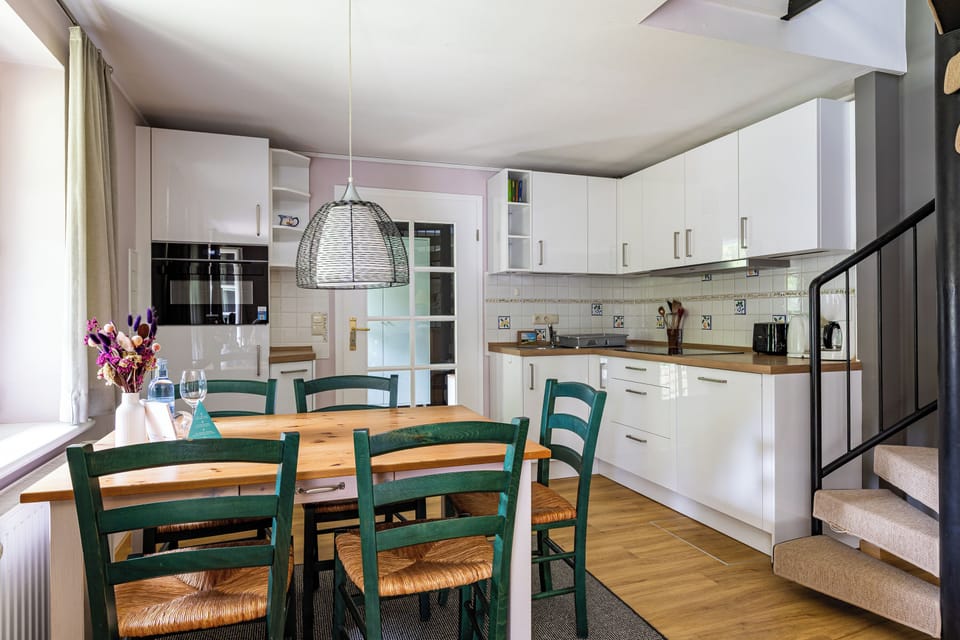 Modern Kitchen with Dining Table and White Furniture