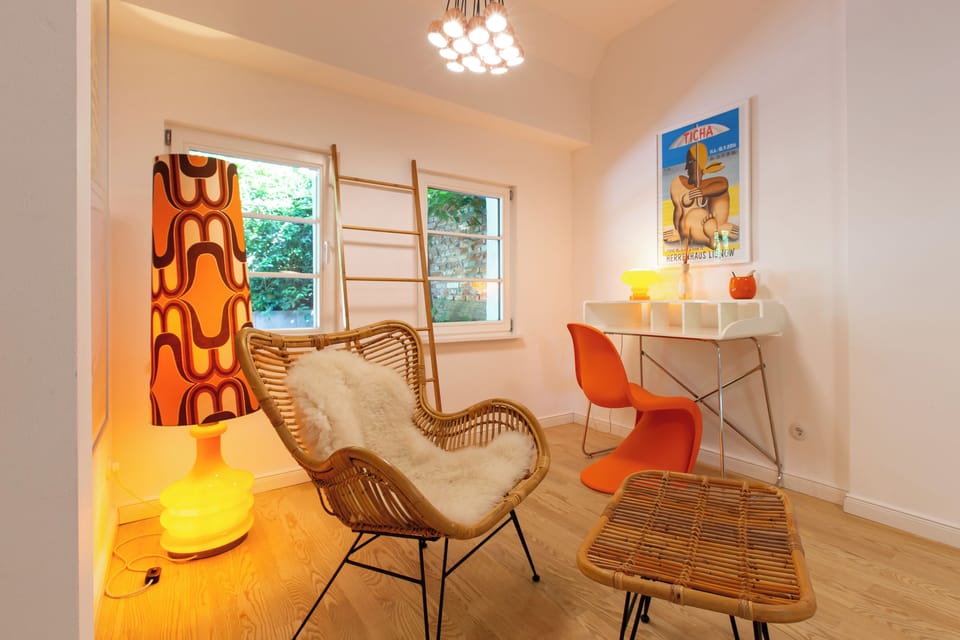 Cozy living room with wicker chair and desk