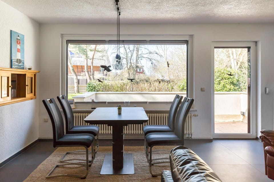 Dining Area with Windows and Green View