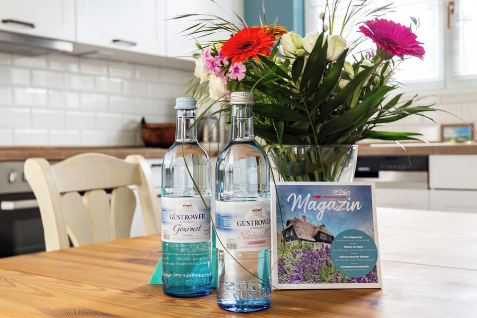 Kitchen with Water Bottles and Flower Bouquet