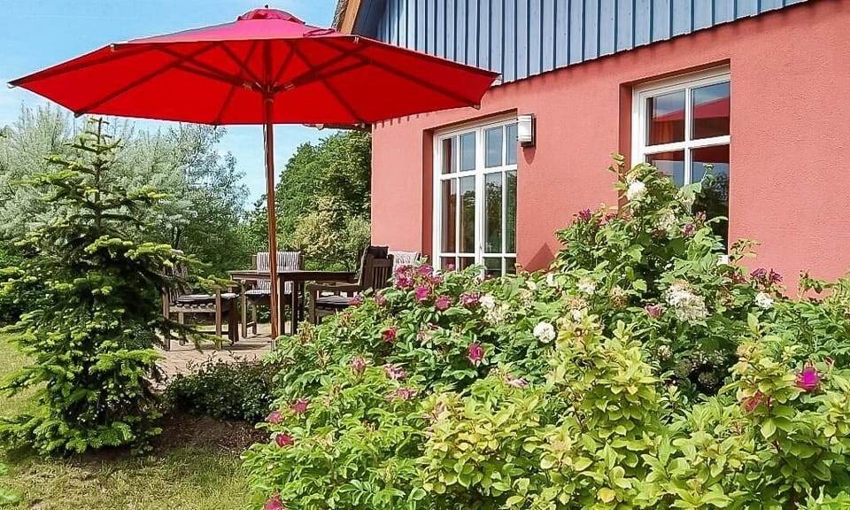 Terrace with table and sun umbrella