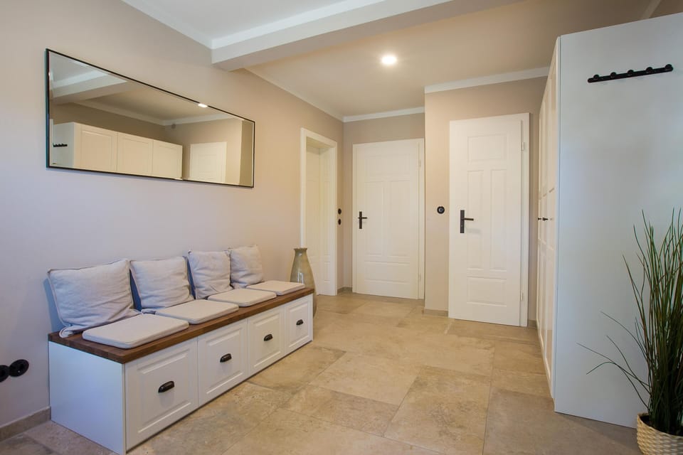 Bright hallway with cozy couch