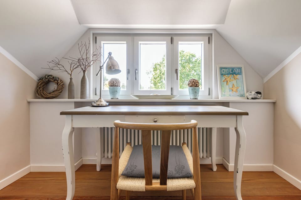 Bright workspace with desk and windows