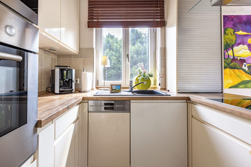 Modern Kitchen with Window and Wooden Countertop